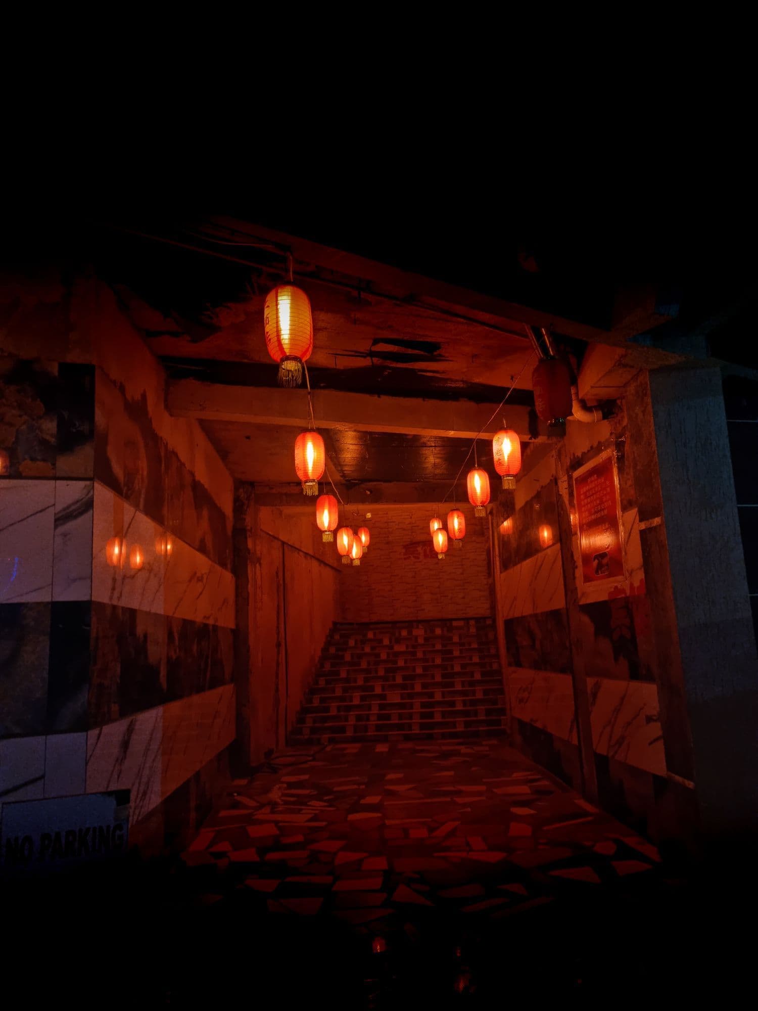 Red lanterns in a dark passage