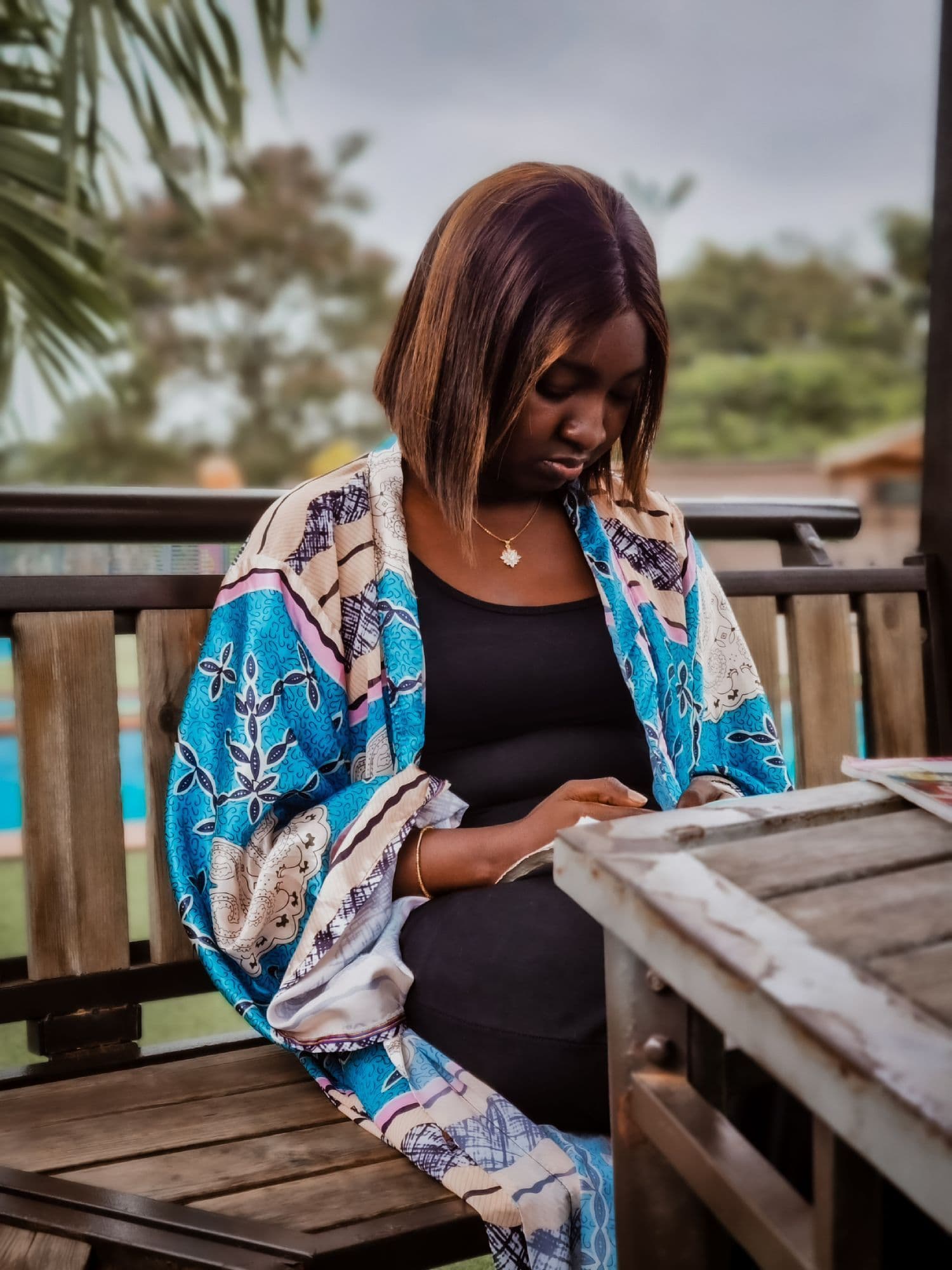 Woman in patterned shawl outdoors