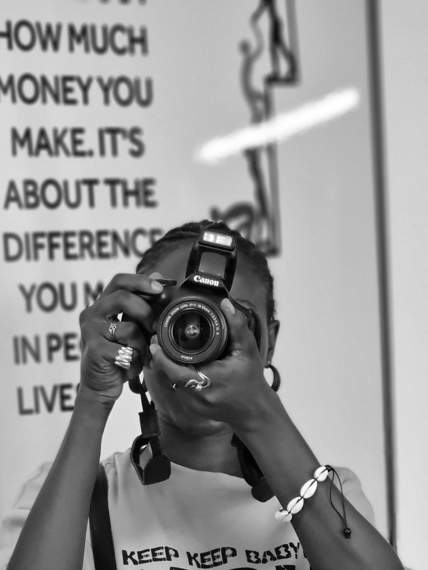 Person holding a camera to their face, taking a picture