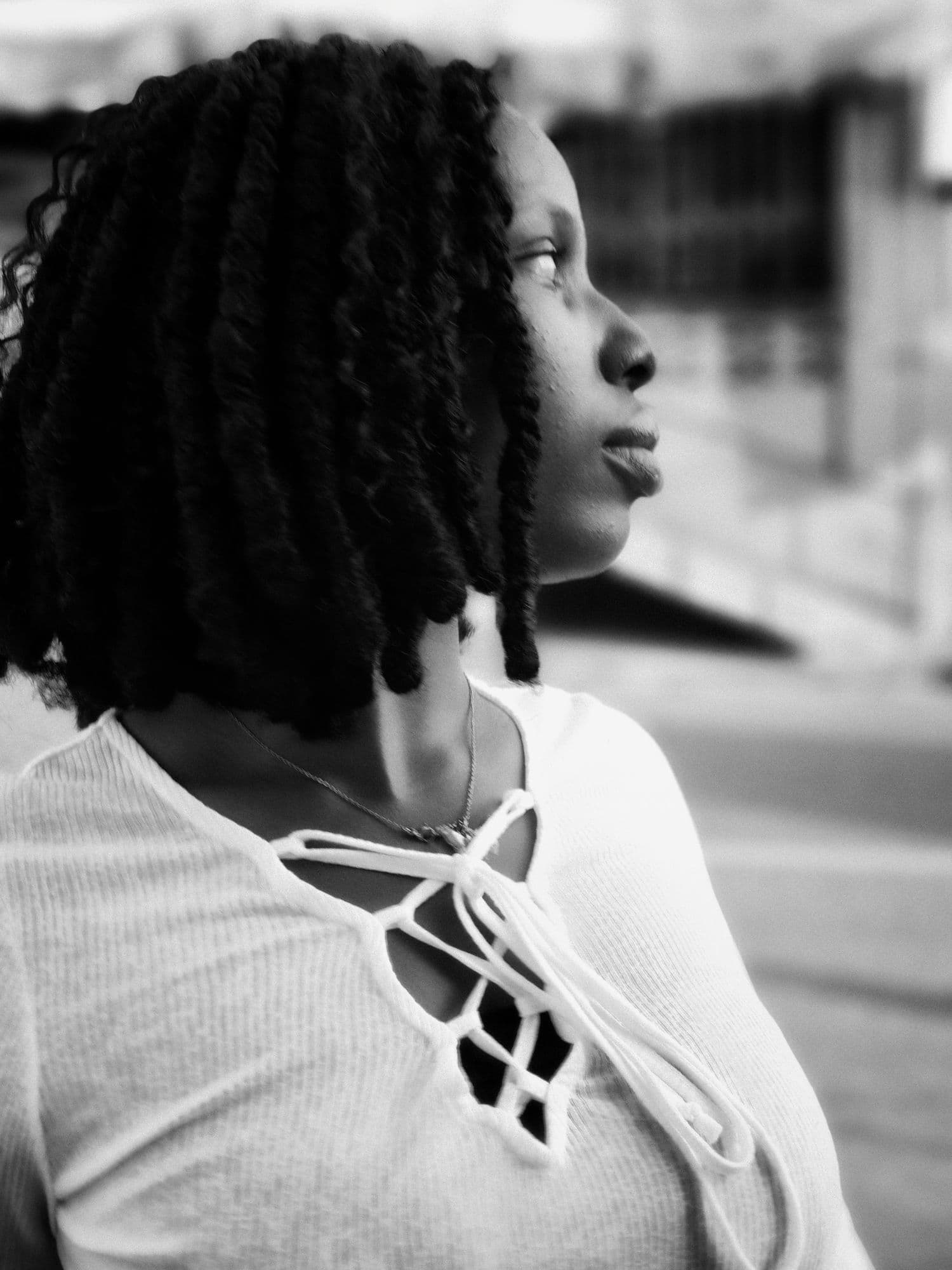 Black and white portrait of a woman looking away